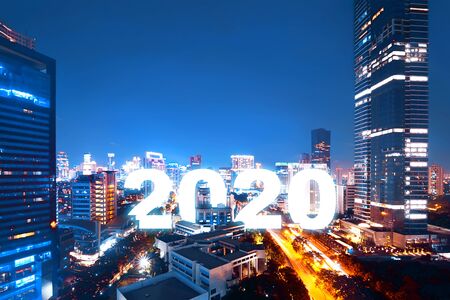 2020 on the city with a night scene background. Happy New Year 2020の写真素材