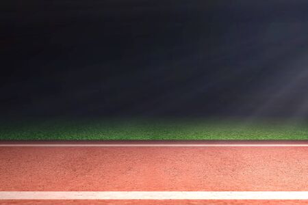 Running track with green grass and light over dark background