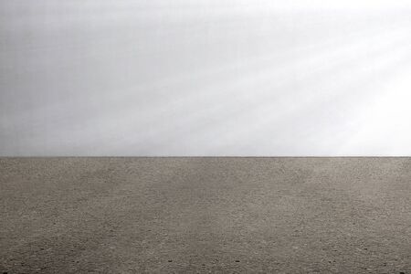 The concrete floor and gray wall with a bright background