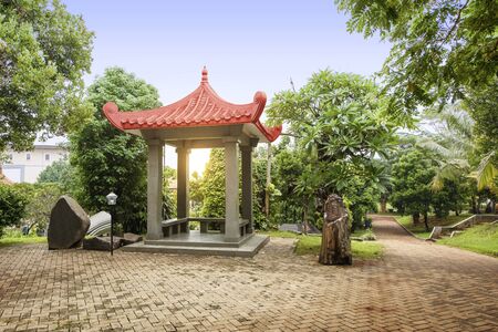 Chinese gazebo building on the park with a blue sky backgroundの写真素材