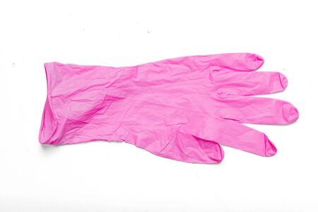Pink latex medical glove isolated over white background