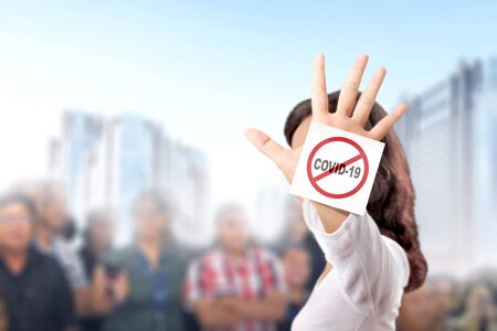 Asian woman showing stop hand gesture for coronavirus. Prevent flu disease Coronavirus