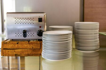Stack of plates for the buffet on the table の写真素材