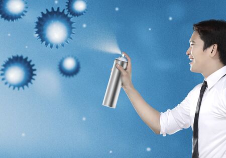 Asian businessman spraying disinfectant to coronavirus. Prevent the spread flu disease Coronavirusの写真素材