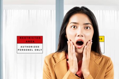 Asian businesswoman shocked in front of the quarantine room in the hospitalの写真素材