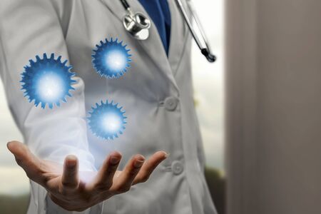 Doctor man with stethoscope showing virtual coronavirus on his hand. Prevent flu disease Coronavirusの写真素材