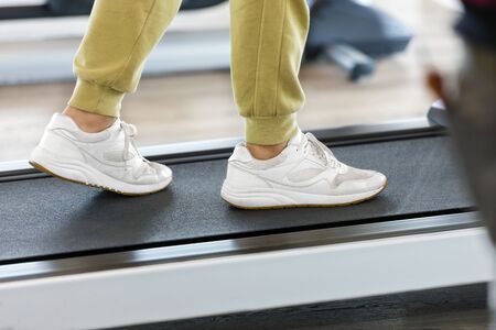 Man exercising on a treadmill in the gymの写真素材