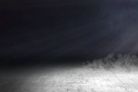 Concrete floor with smoke and light on the dark room