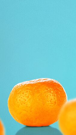 Oranges on vivid blue background. Stories template for summerの写真素材