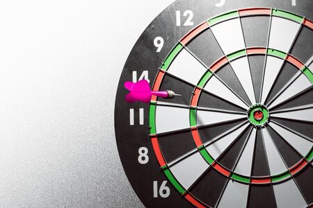Closeup view of arrow missing the target in the dartsの写真素材
