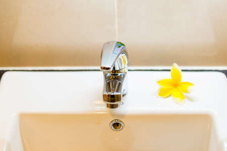 Close up view of the sink faucet in the bathroom