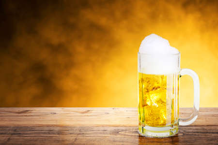 The glass of cold beer on the table. Beer for celebrating Oktoberfestの写真素材