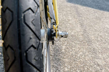 Bicycle on the street with a black wall background