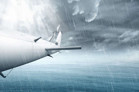 Airplane flying in the air with rainy weatherの写真素材