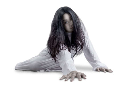 Scary ghost woman crawling isolated over white background. Halloween concept