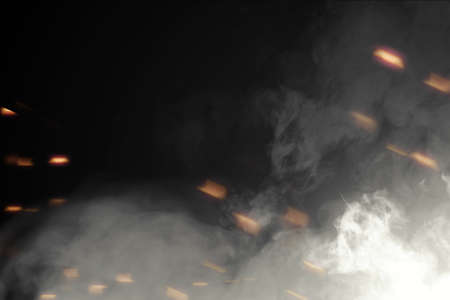 White smoke with sparks on black background