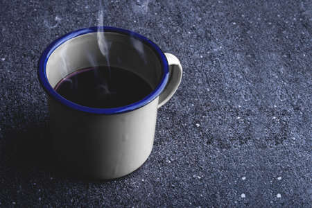 Cup of hot coffee on the tableの写真素材