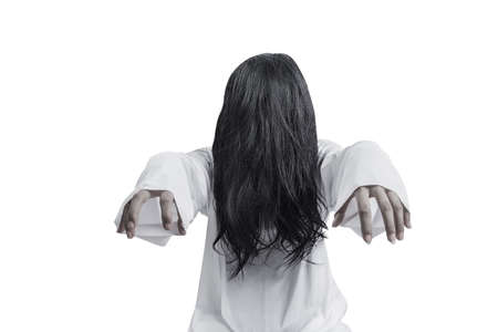 Scary ghost woman standing isolated over white background. Halloween concept