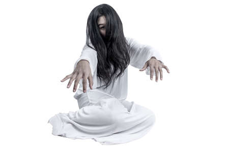 Scary ghost woman crawling isolated over white background. Halloween conceptの写真素材