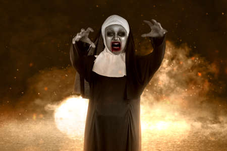 Scary devil nun standing with the explosion background