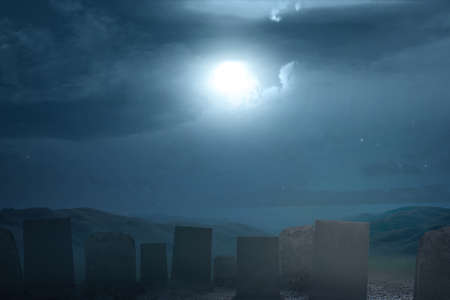Tombstones on the graveyard with full moon background. Halloween conceptの写真素材