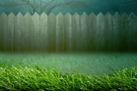 Wooden fence with fog and night scene backgroundの写真素材