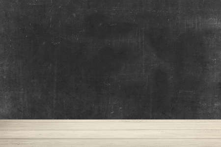 Wooden table with black wall backgroundの写真素材