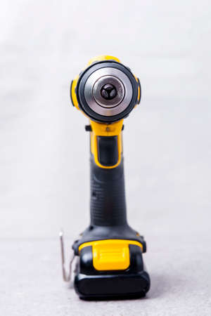 Cordless yellow drill on the tableの写真素材