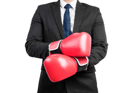 Businessman with red boxing gloves isolated over white backgroundの写真素材