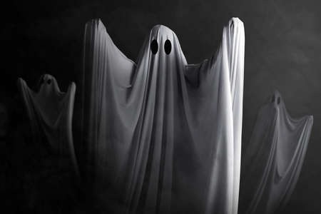 White ghost haunting with a dark background. Halloween conceptの写真素材