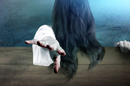 Scary ghost woman standing with night scene background. Halloween conceptの写真素材