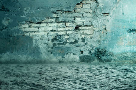 Ground with ruined brick wall background