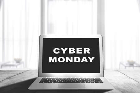 Cyber Monday advert on the laptop screen on the desk. Cyber Monday concept
