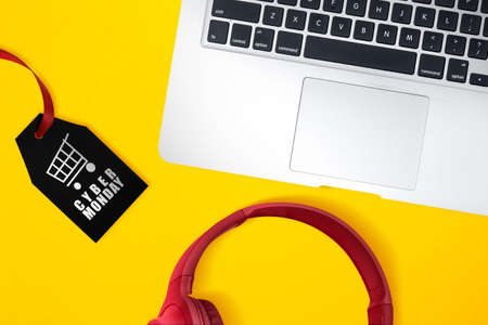 Black label with Cyber Monday text on wooden background. Cyber Monday concept