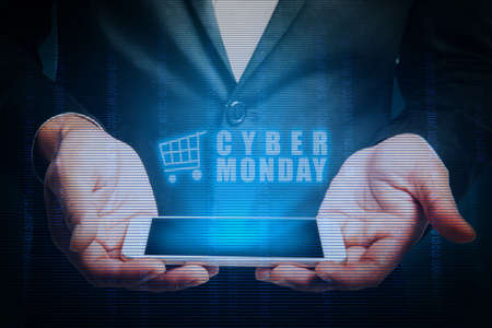 Businessman showing Cyber Monday advert from the phone screen. Cyber Monday concept