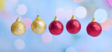 Colorful Christmas ball hanging with blurred light background