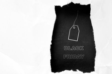 Ripped paper with Black Friday text on black background. Black Friday Conceptの写真素材