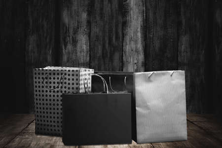 Shopping bag with a wooden background. Black Friday concept
