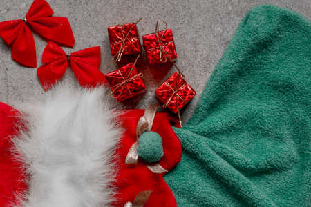 Christmas stocking with colorful Christmas ornament on the floorの写真素材