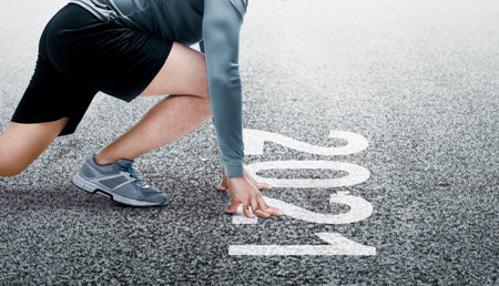 Runner man ready to run on the 2021 line. Happy New Year 2021の写真素材