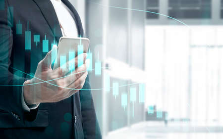 Businessman with mobile phone showing a dollar virtual bar chart with digital background