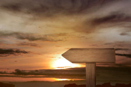 Blank wooden sign with sunset sky background. Blank wooden for copy space