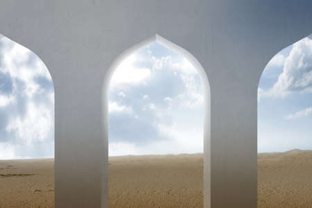 Mosque window with a desert view and blue sky backgroundの写真素材