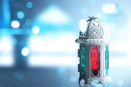 Arabic lamp with colorful light with blurred light backgroundの写真素材