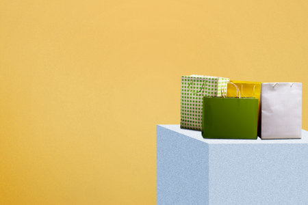 Shopping bag on the display with a colored background