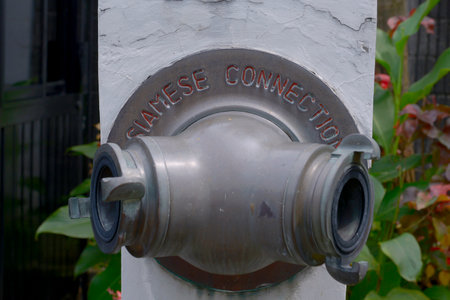 Close up view of a fire hydrant at a sidewalk