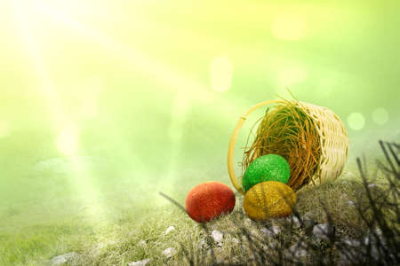 Colorful easter eggs spilled from the nest on the wooden basket. Happy Easter