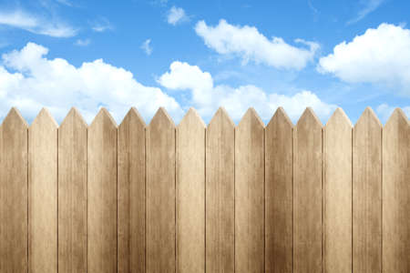 Wooden fence with a blue sky backgroundの写真素材