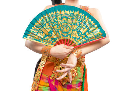 Woman dancing Balinese traditional dance isolated over white backgroundの写真素材