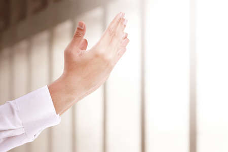 Muslim man raised hands and praying in the mosqueの写真素材